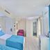 Glamour Hotel Istanbul Sirkeci guest room with twin beds and turquoise upholstered headboard in Istanbul