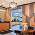 Blaine Town Inn & Suites lobby with coffee station, seating area, and geometric wood wall panels in Blaine
