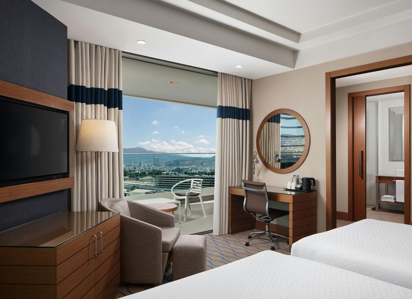 Four Points by Sheraton Izmir room with balcony view, desk, chair and seating area in Izmir