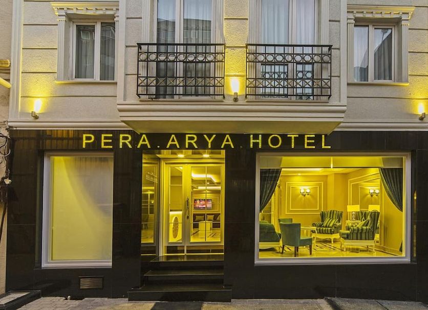 Pera Arya Hotel in Istanbul exterior with lit entrance and street-facing windows