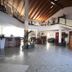 Hotel Riz B.B in San Genesio ed Uniti lobby with curved staircase and high wood-beamed ceiling