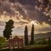 Fonteverde Lifestyle & Thermal Retreat in San Casciano Dei Bagni with rolling hills and dramatic sunset sky