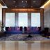 H Resort in Shihzih Township lobby seating area with purple sofas, armchairs, and a patterned rug