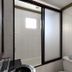 S&C Hotel Suites and Apartments in Koror bathroom with tiled shower and frosted glass partition
