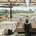 La Réserve Resort in Knokke Heist restaurant terrace with canal views and outdoor dining tables