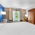 Comfort Inn Greenville - Haywood Mall guest room with king bed, TV, chair, desk and window view