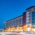 Ji Hotel Shenyang Zhangshi Development Zone exterior in Shenyang at dusk with curved glass facade