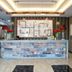 Big Hotel Suites Mandaue City lobby front desk with stone reception counter and modern ceiling lights