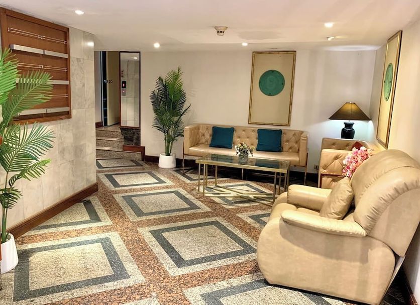 City Lodge Bangkok lobby seating area with patterned tile floor and beige sofas in Bangkok