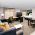 Residence Inn by Marriott New Orleans Elmwood room with bed, desk, sofa, kitchenette and TV