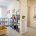 Bb Dolce Luna in Florence lobby area with magazine rack, glass shelving, and wicker basket