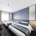 Shin Osaka Esaka Tokyu Rei Hotel room in Suita with two single beds and a desk