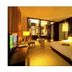 The Pearl Boutique Hotel Lishui room with king bed, warm lighting, desk and seating area