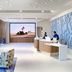 Luma Hotel San Francisco lobby with front desk, lounge seating, and large wall display in San Francisco