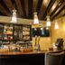 Isabella Boutique Hotel in San Pedro Sula bar with hanging pendant lights and stocked shelves