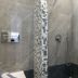 Hotel Lodos in Karterados bathroom with tiled walk-in shower and mosaic sink vanity