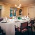 Stallmästaregården Hotel, Stockholm dining room with a set round table and classic wallpaper
