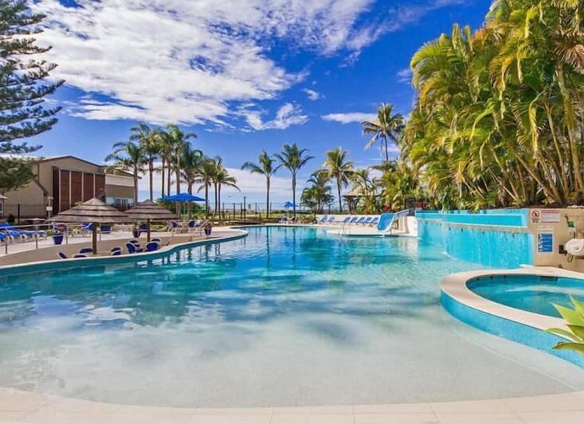 Royal Palm Resort in Palm Beach with a tropical lagoon-style pool, palm trees, and ocean view