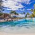 Royal Palm Resort in Palm Beach with a tropical lagoon-style pool, palm trees, and ocean view