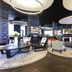 Novotel Basel City Basel lobby lounge with modern seating and curved ceiling lights