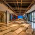 Puruihotel Yongkang lobby with marble floor, decorative ceiling, and floor-to-ceiling windows in Jinhua
