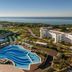 W Algarve in Albufeira with a wave-shaped outdoor pool and ocean view from the resort
