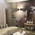 Iris Hotel Erbusco lounge seating area with patterned wall art and modern decor