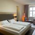 Flair Hotel zum Schiff in Meersburg guest room with twin bed, seating area and window view