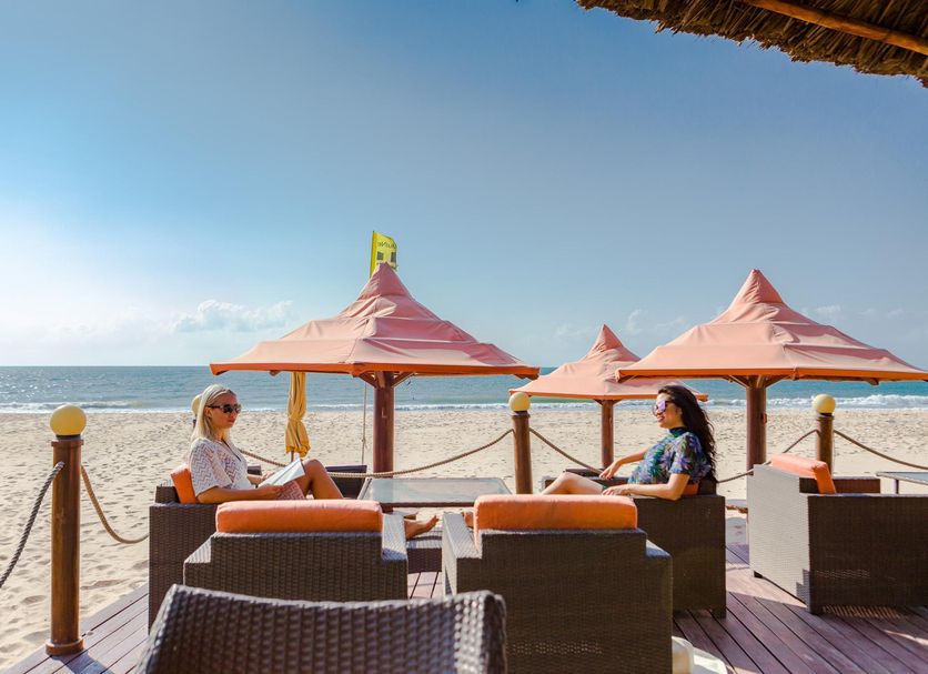 Unique Mui Ne Resort and Spa in Phan Thiet: beachfront lounge seating and ocean view