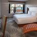 Hotel Adeline, Scottsdale: guest room with king bed, lounge chair, and balcony view