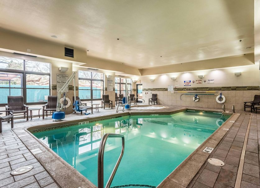 Indoor pool at Fairfield Inn & Suites by Marriott Alamogordo with lounge chairs and large windows