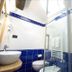 Affittacamere Da Cesare in Monterosso al Mare bathroom with blue tile, sink, toilet and glass shower