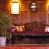 Holbeck Ghyll Country House Estate in Windermere lobby with carved wood bench and floral decor