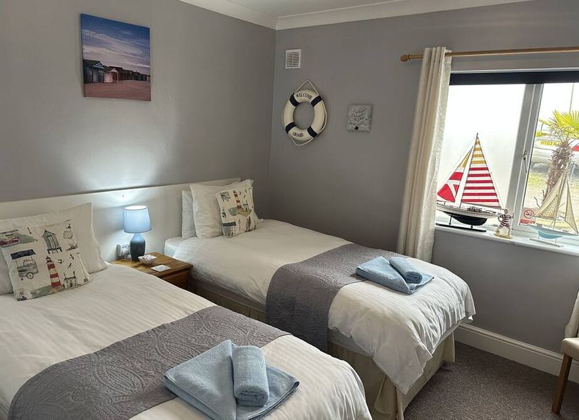 Hogwarts Bed and Continental Breakfast in Sheerness, twin guest room with window view and bedside lamp