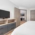 Candlewood Suites Houston (The Woodlands) By IHG guest room with bed, TV, dresser and closet in The Woodlands