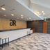 GR Hotel Ginzadori lobby in Kumamoto with reception desk, geometric tile floor and seating area
