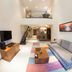 Oakwood Residence Kapil Hyderabad loft-style suite with staircase, living area and mezzanine balcony