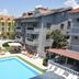 Nur Apart in Marmaris with outdoor pool, sun loungers, and apartment balconies