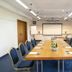 Landhotel Kauzenberg in Bad Kreuznach meeting room with conference table, projector screen, and blue chairs