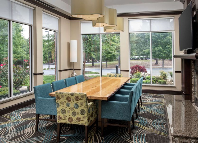 Hilton Garden Inn Charlotte/Mooresville meeting room with conference table and large windows in Mooresville