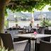 Hotel Rhein-Residenz in Bad Breisig riverside terrace with wicker seating and Rhine views