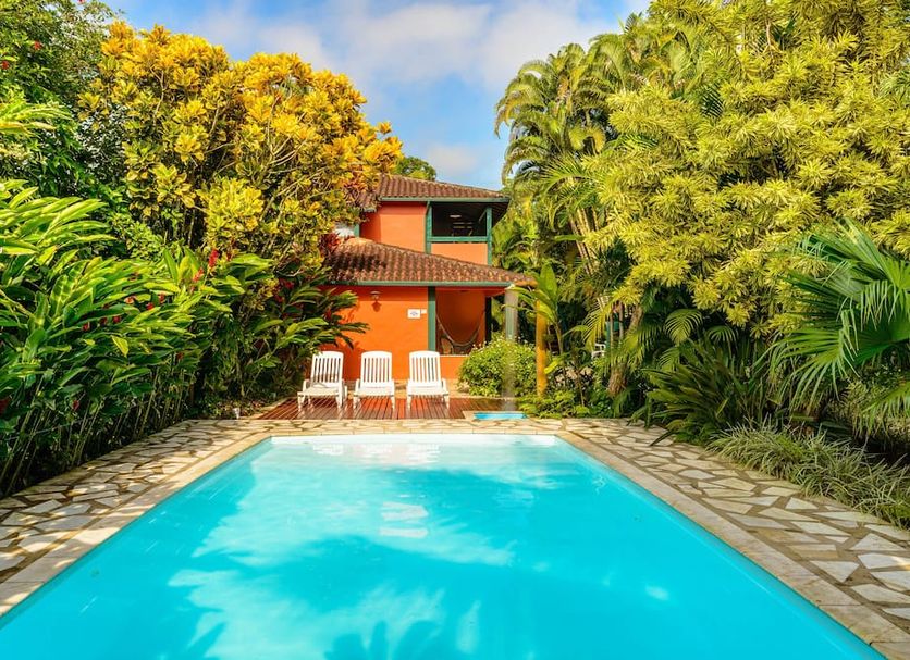 Pousada Ecoilha in Ilhabela with a small outdoor pool surrounded by lush tropical greenery