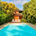 Pousada Ecoilha in Ilhabela with a small outdoor pool surrounded by lush tropical greenery