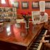 Hotel Colvenier in Antwerp with a chef and guest at a grand piano in a restaurant setting