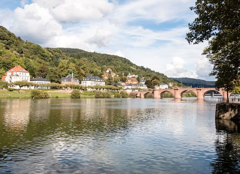 Hotel Villa Marstall in Heidelberg with river view, hillside village, and stone bridge
