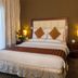 Flora Park Deluxe Hotel Apartments in Dubai, guest room with king bed, bedside lamps and sheer curtains