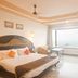 Hotel Sea View in Kanyakumari guest room with large ocean-view window and king bed