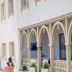 Hotel Altes Kurhaus in Ostseebad Baabe with arched balcony facade and potted topiary