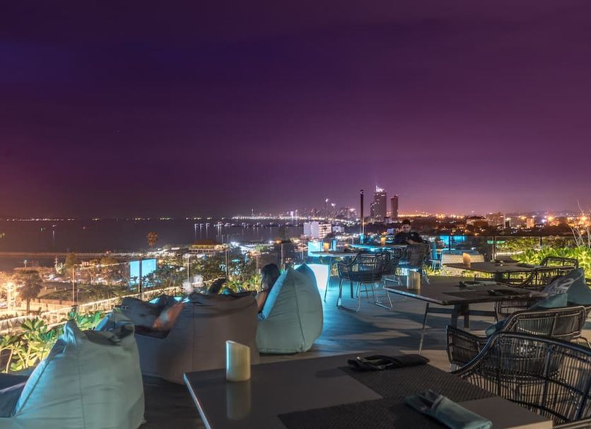 Seaphere Pattaya Hotel by Elite Suites rooftop terrace with city lights and outdoor seating in Pattaya