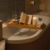Hotel Del Golfo in Finale Ligure bathroom with a wooden bath tray, open book, wine glass, candle and towel